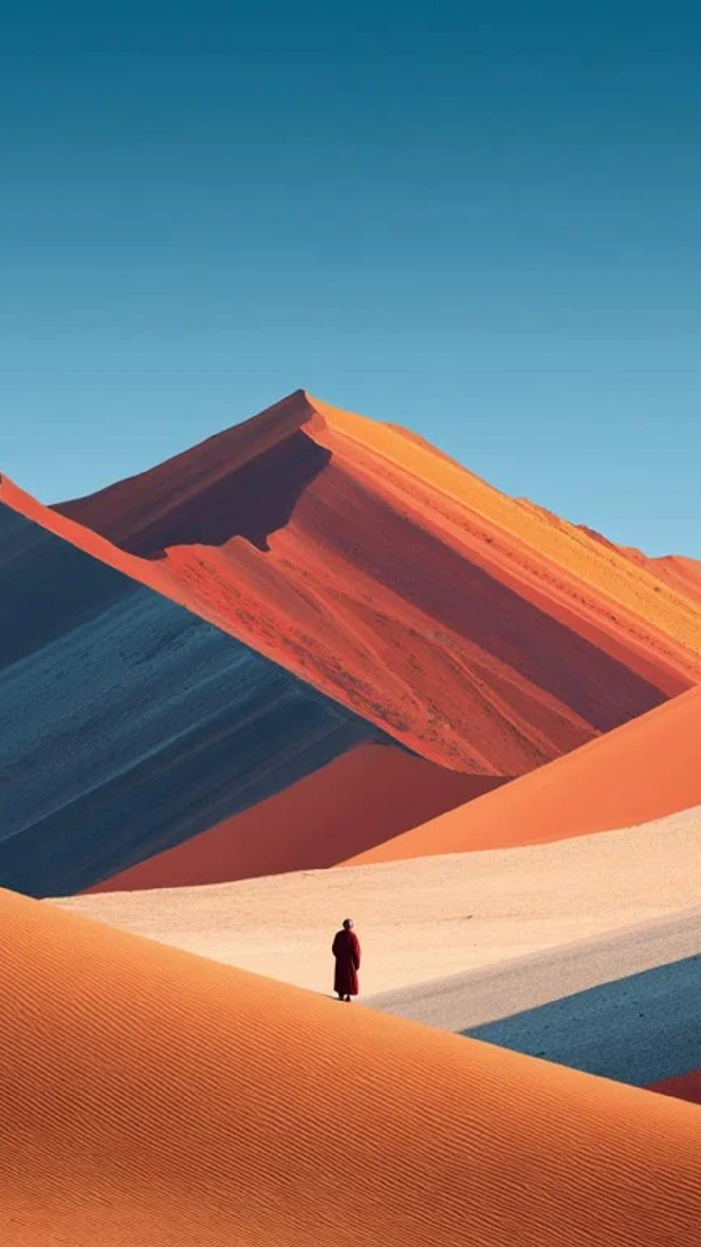 Vibrant Desert Dunes and a Figure in Red Robe